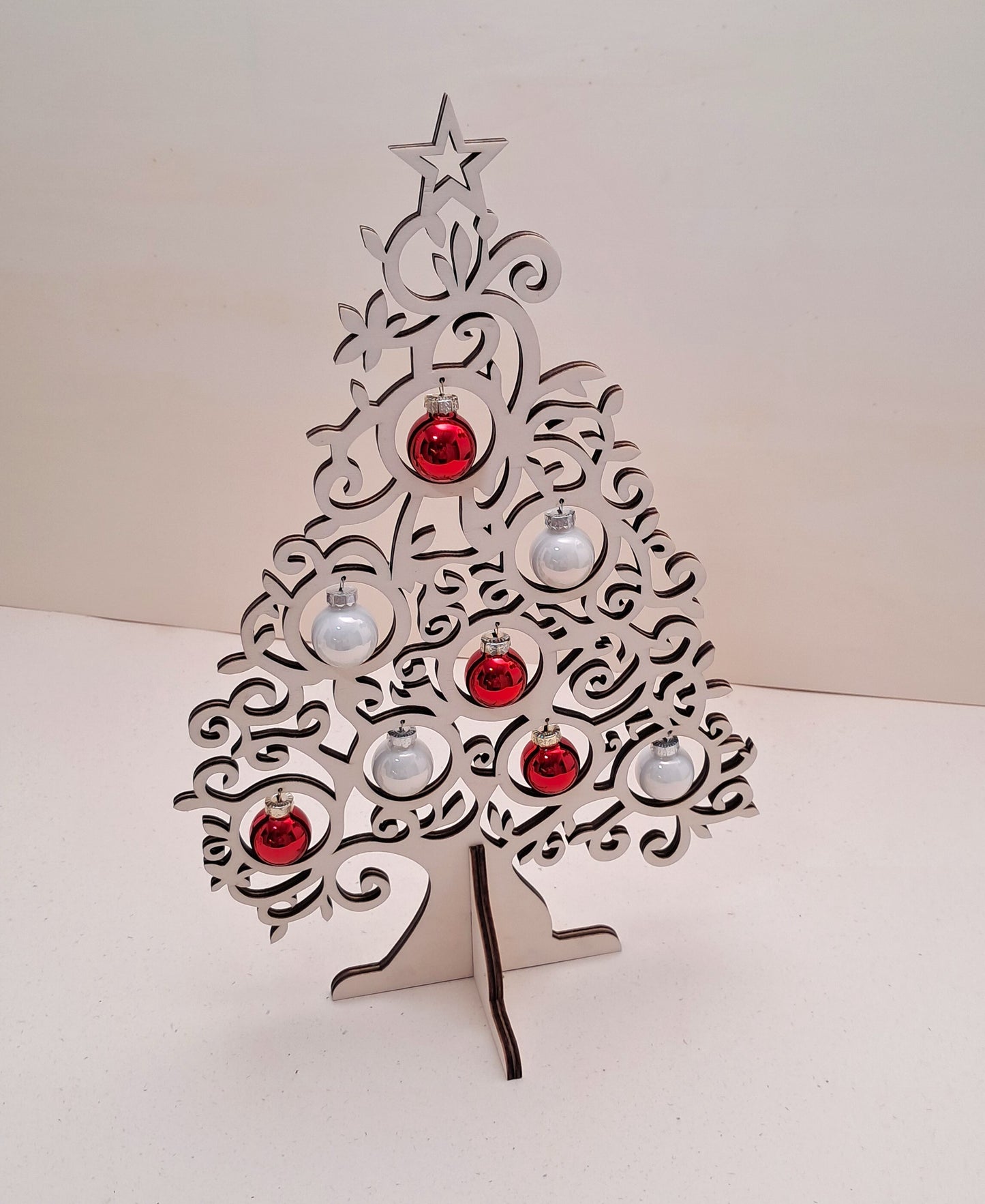 Wooden tabletop Christmas tree with glass baubles