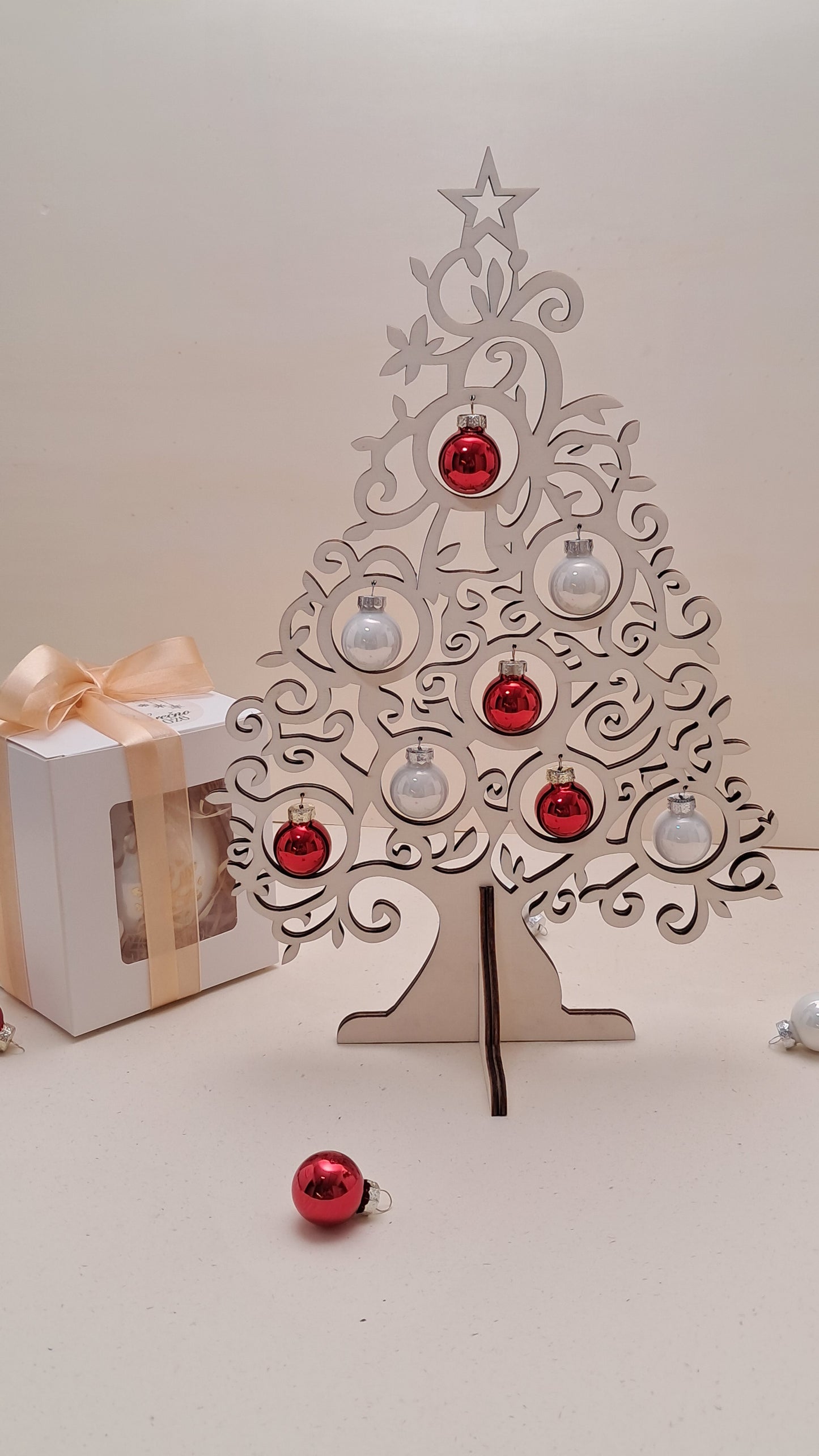Wooden tabletop Christmas tree with glass baubles