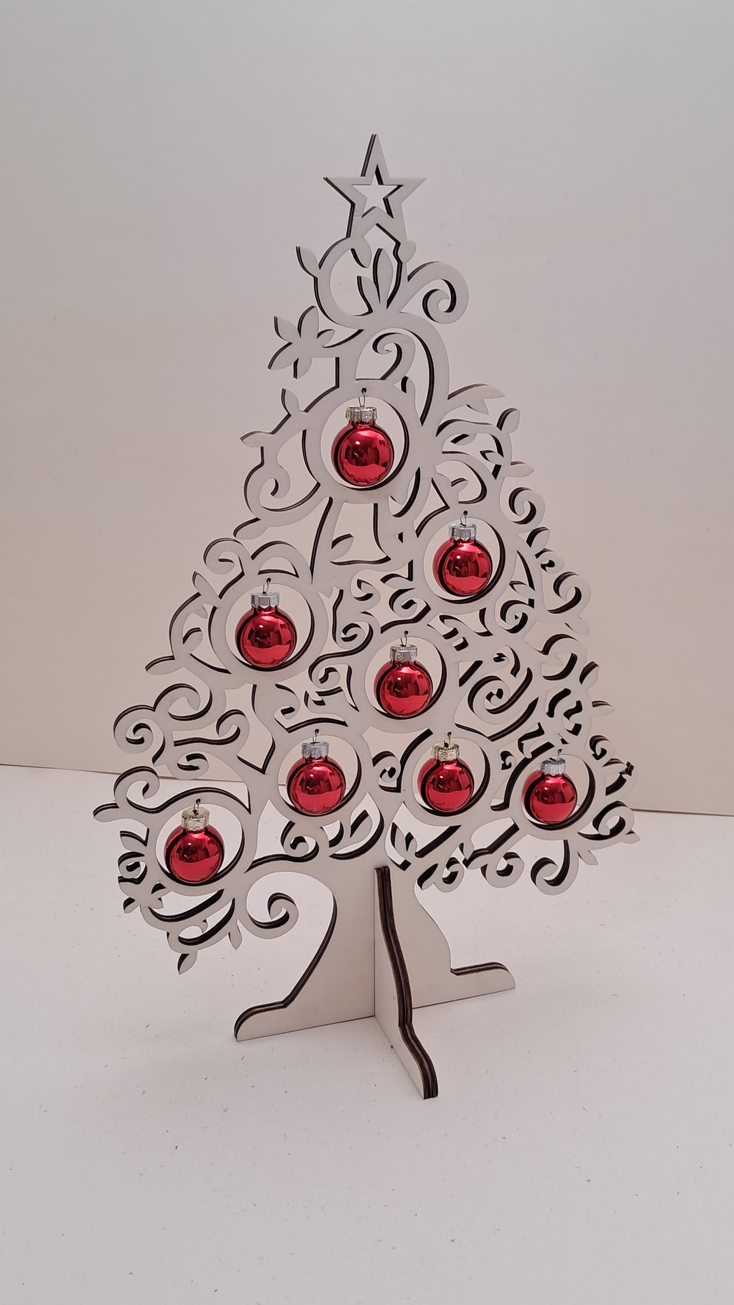 Wooden tabletop Christmas tree with glass baubles