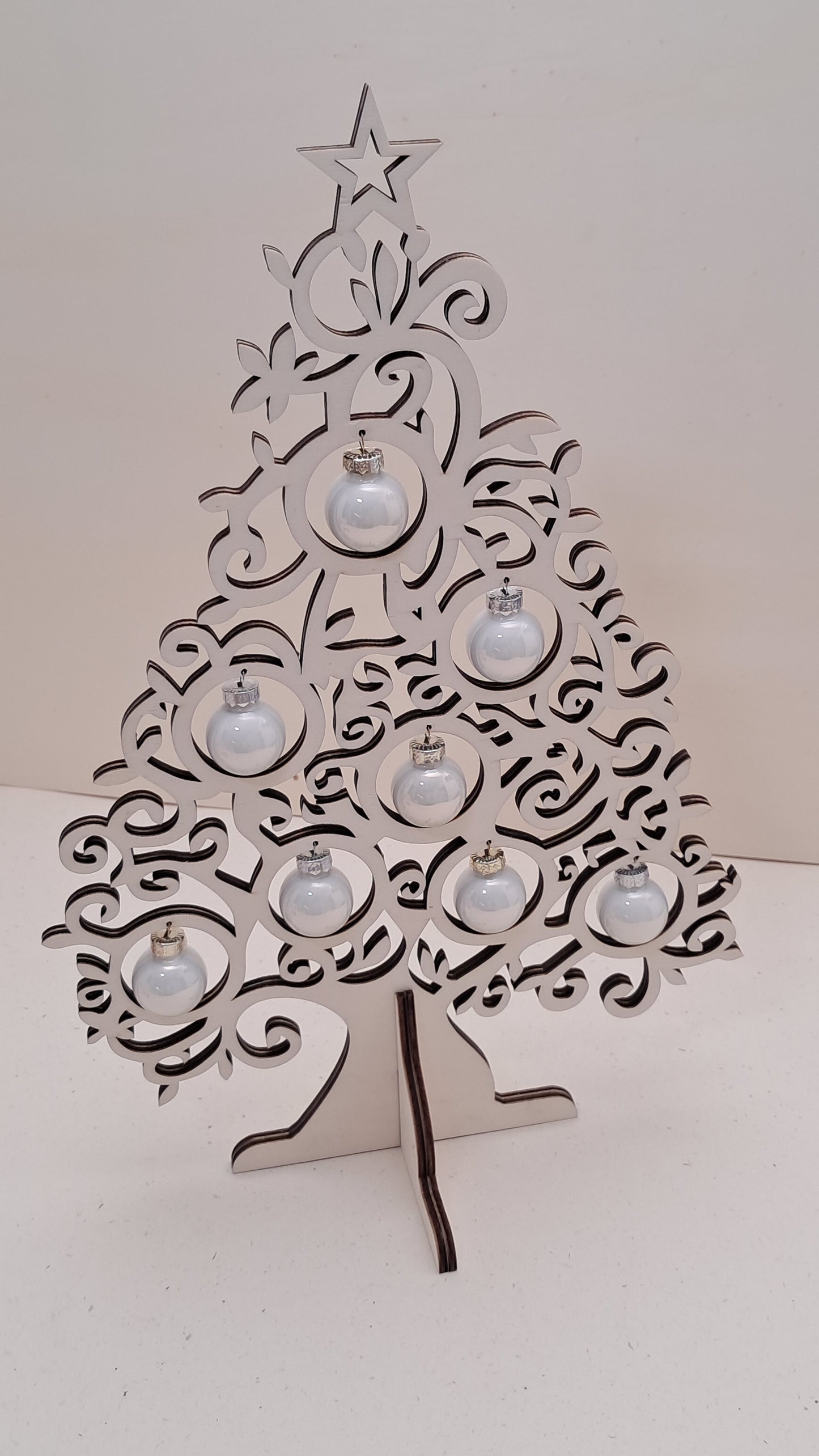 Wooden tabletop Christmas tree with glass baubles